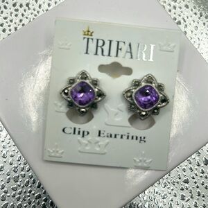 Crown trifari purple rhinestone silver tone clip earrings floral bezel design